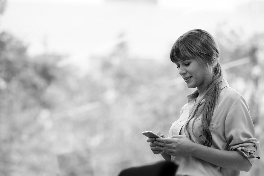 young woman looking at her mobile phone